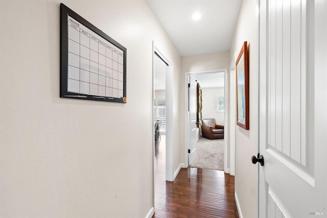 corridor featuring dark hardwood / wood-style floors