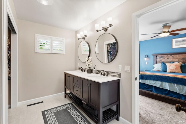 bathroom with ceiling fan and vanity