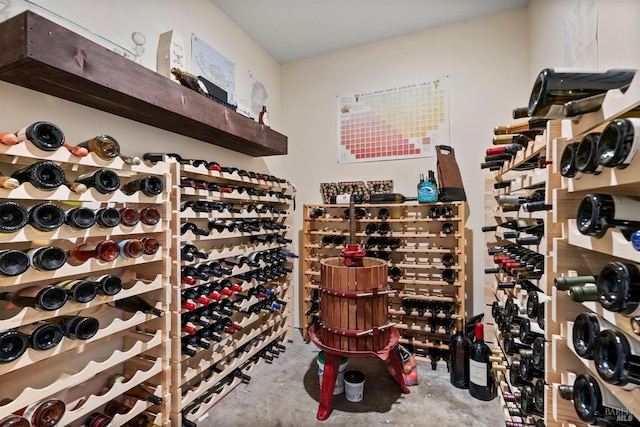 wine cellar featuring concrete flooring