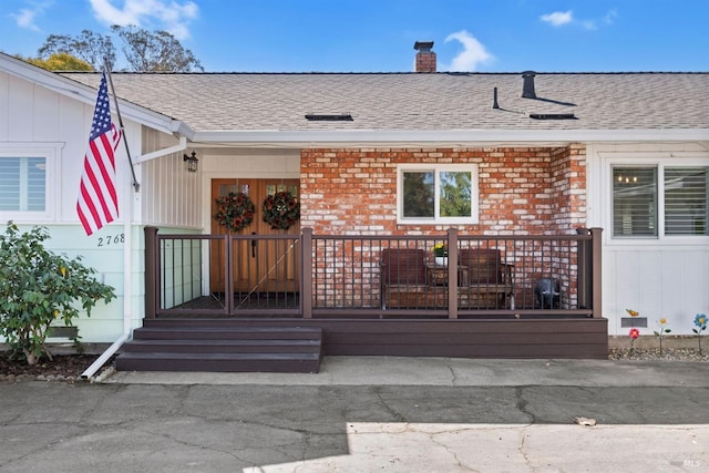 view of exterior entry featuring french doors