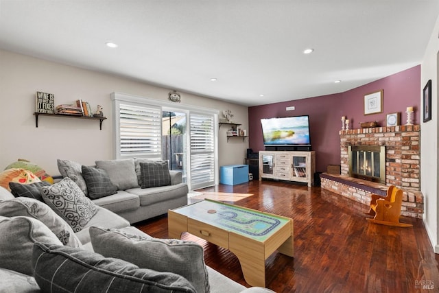 living room featuring a fireplace and dark hardwood / wood-style flooring