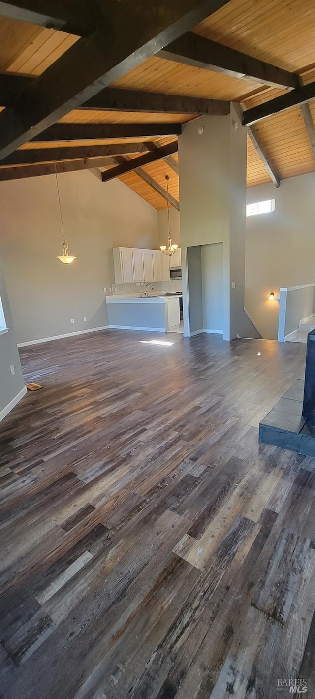 bonus room with dark wood-type flooring, sink, beam ceiling, high vaulted ceiling, and wooden ceiling