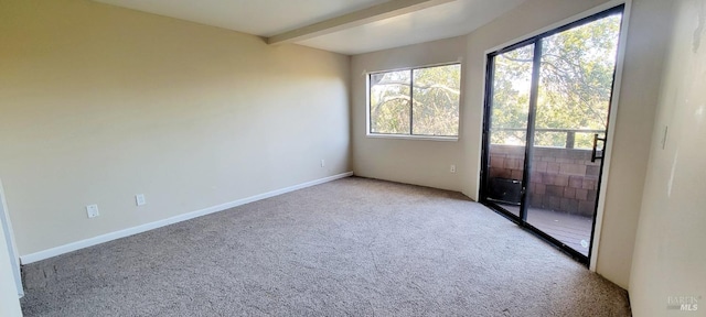 empty room with light carpet and beamed ceiling