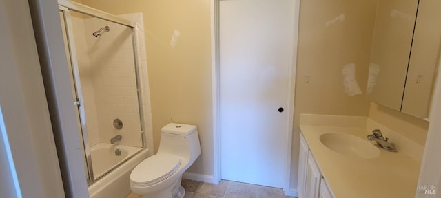 full bathroom with shower / bath combination with glass door, vanity, toilet, and tile patterned floors