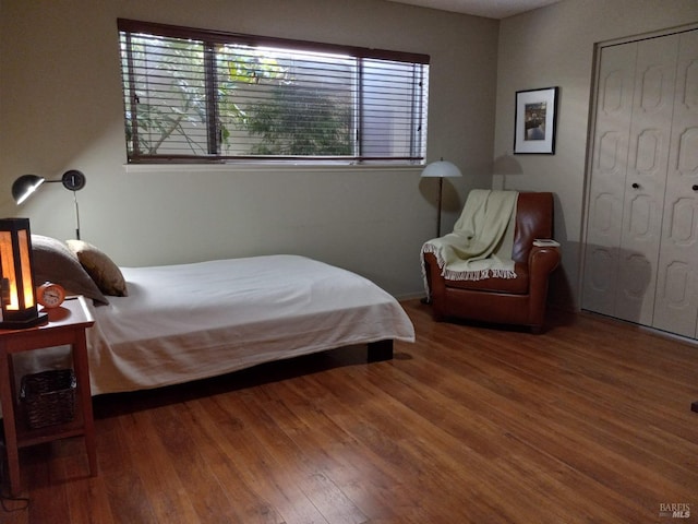 bedroom featuring wood finished floors
