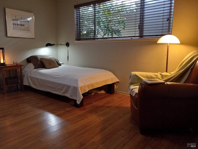 bedroom with wood finished floors
