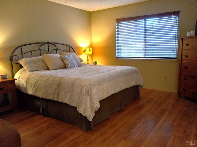 6472 Stone Bridge Rd, Santa Rosa, CA 95409 - bedroom with wood finished floors and baseboards