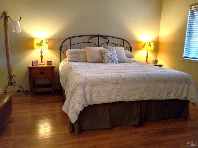 bedroom featuring wood finished floors