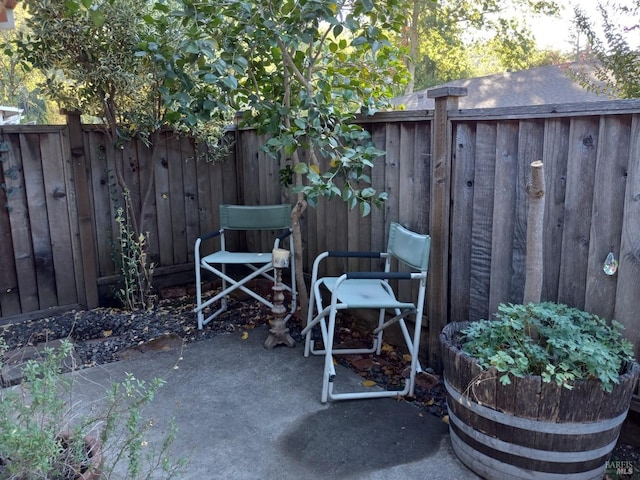 view of patio / terrace featuring fence