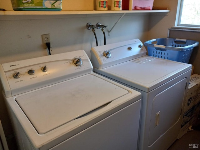 laundry room with washer and clothes dryer and laundry area