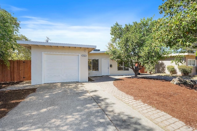 ranch-style home with a garage