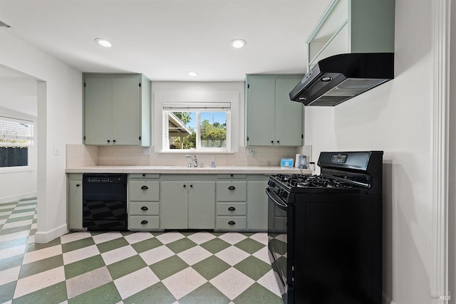 kitchen featuring range hood, black appliances, and tasteful backsplash