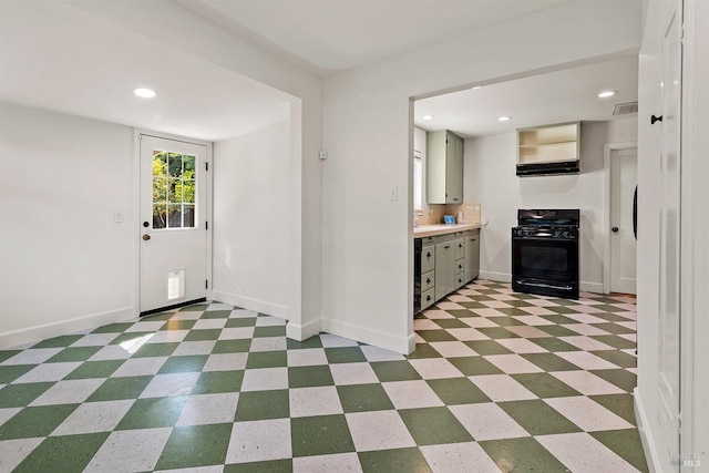 kitchen featuring black range with gas cooktop and exhaust hood