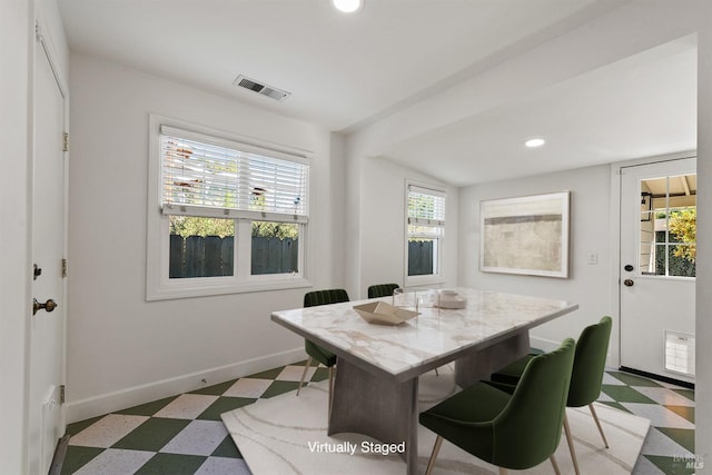 view of carpeted dining space