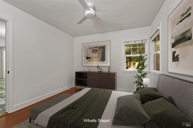 bedroom featuring wood-type flooring and ceiling fan