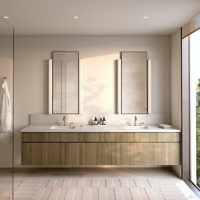 bathroom featuring a wealth of natural light and vanity