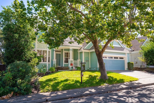 view of front of property with a garage and a front yard