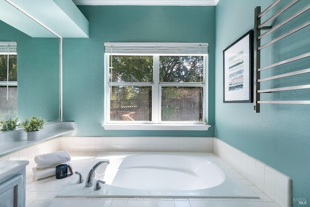 bathroom with a bath and a healthy amount of sunlight