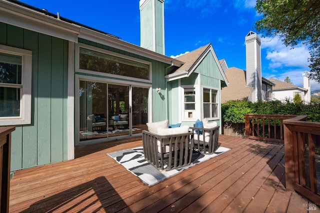 deck with outdoor dining area