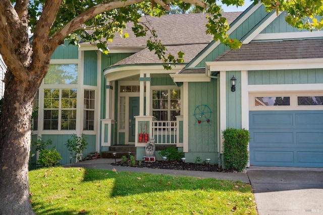 doorway to property featuring an attached garage and a shingled roof