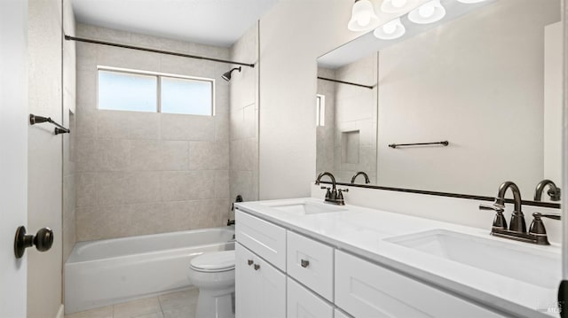 full bathroom with tiled shower / bath combo, tile patterned flooring, vanity, and toilet