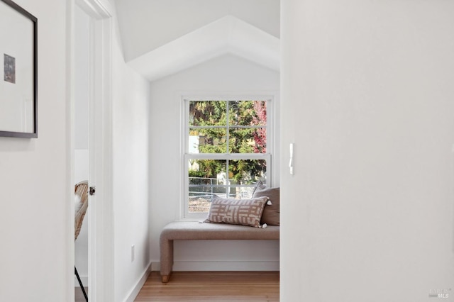 sitting room with lofted ceiling and hardwood / wood-style flooring