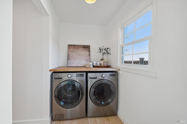 washroom featuring light hardwood / wood-style floors and independent washer and dryer