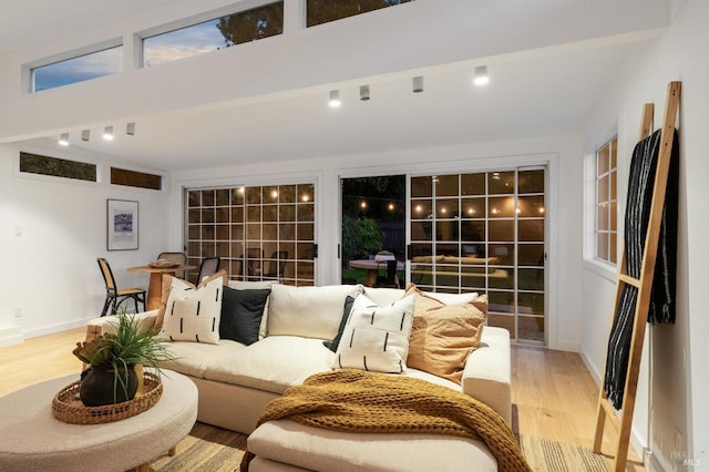 living room with light hardwood / wood-style flooring