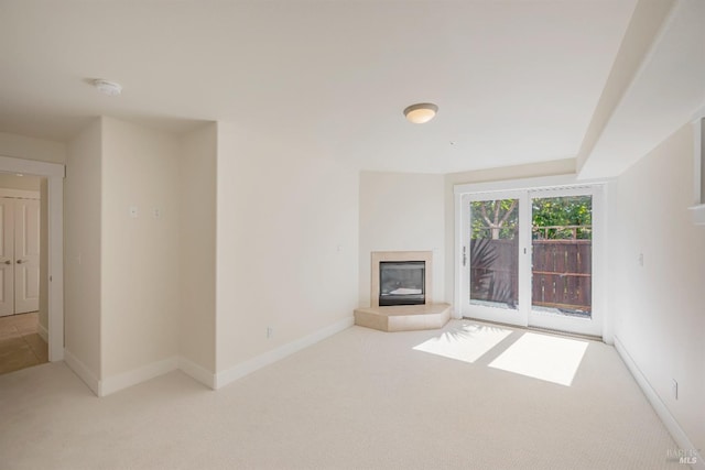 unfurnished living room with light colored carpet