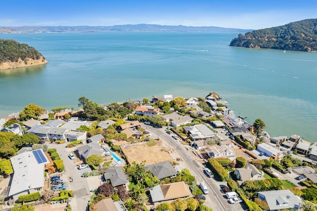 bird's eye view with a water and mountain view