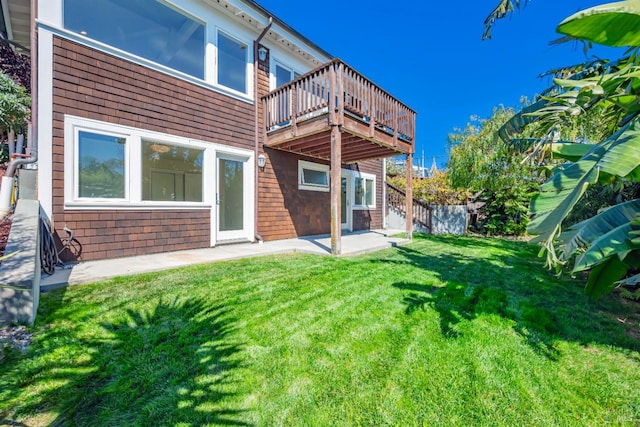 back of house with a yard and a patio area