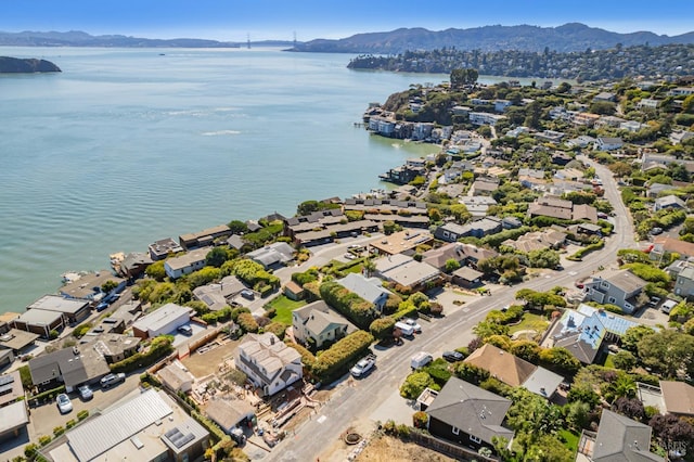 aerial view featuring a water and mountain view