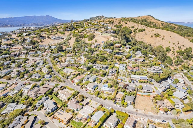 drone / aerial view with a water and mountain view