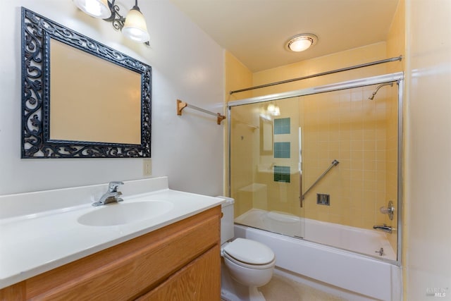 full bathroom with vanity, toilet, and combined bath / shower with glass door