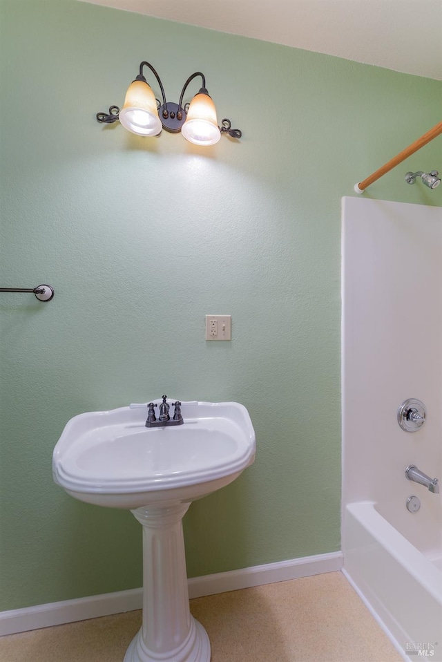 bathroom with washtub / shower combination