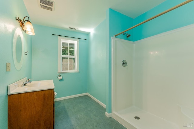 bathroom with vanity, toilet, and walk in shower