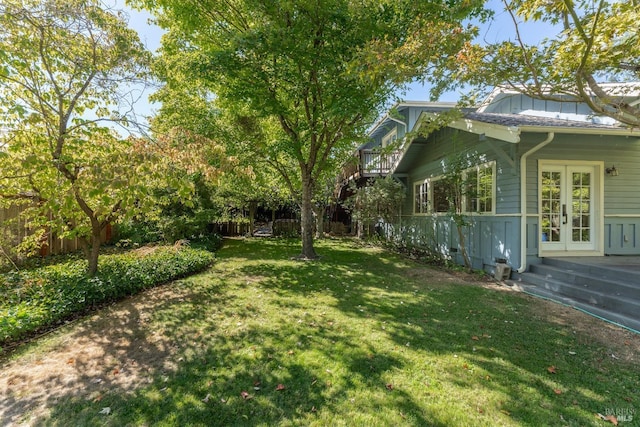 view of yard featuring french doors