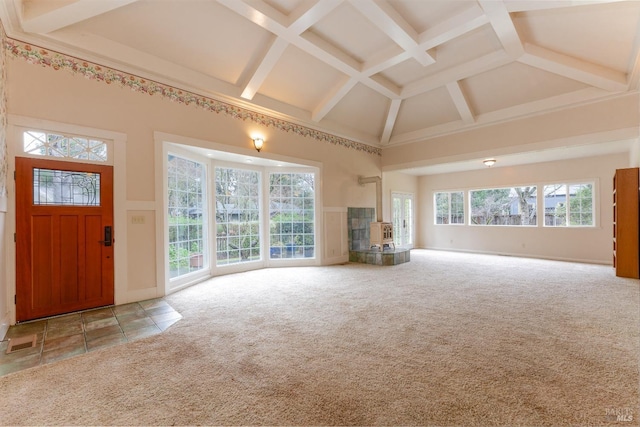 unfurnished living room with beamed ceiling, coffered ceiling, carpet flooring, and high vaulted ceiling