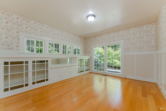 unfurnished living room with hardwood / wood-style floors