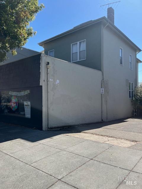 view of side of home featuring a garage