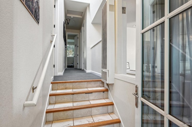 staircase with tile patterned floors