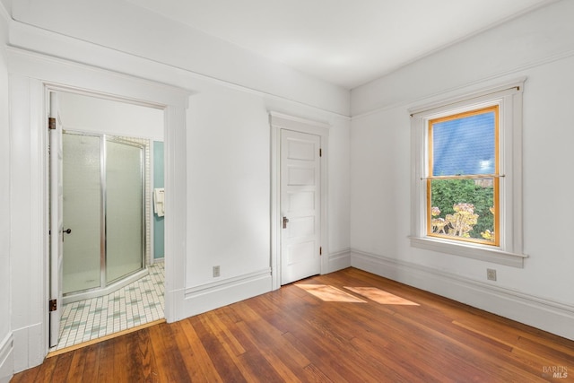 empty room with hardwood / wood-style floors