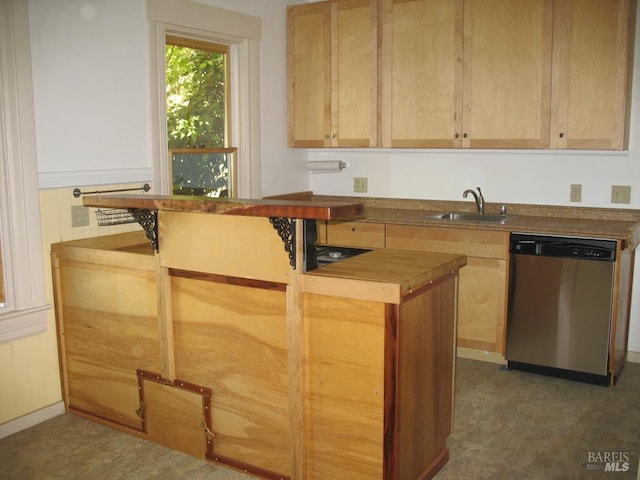 kitchen with dishwasher, butcher block counters, light brown cabinets, and sink