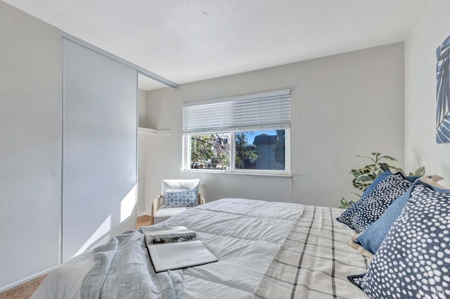 bedroom featuring carpet