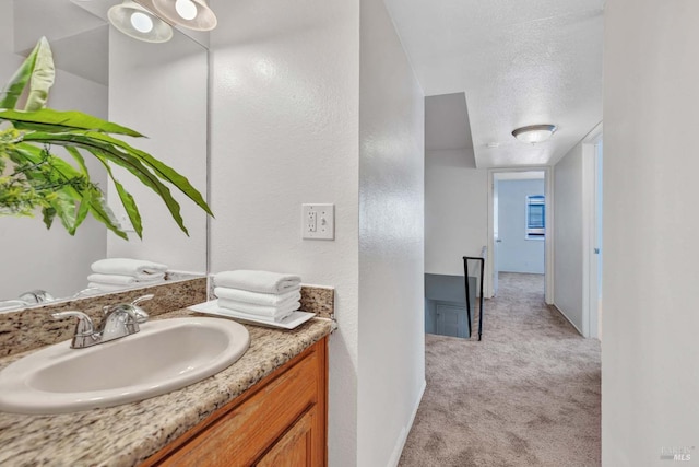 bathroom featuring vanity and a textured ceiling
