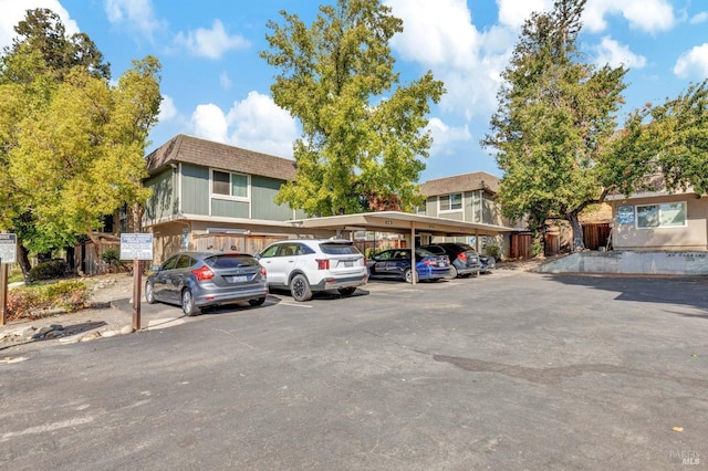 view of partially covered parking lot