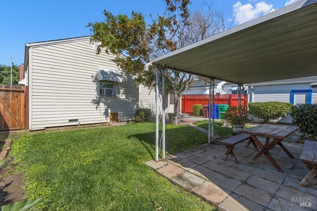 view of yard featuring a patio area and fence