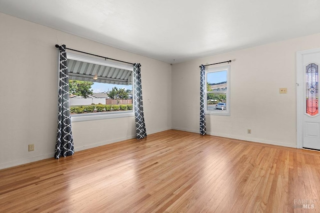 interior space featuring plenty of natural light and light hardwood / wood-style floors