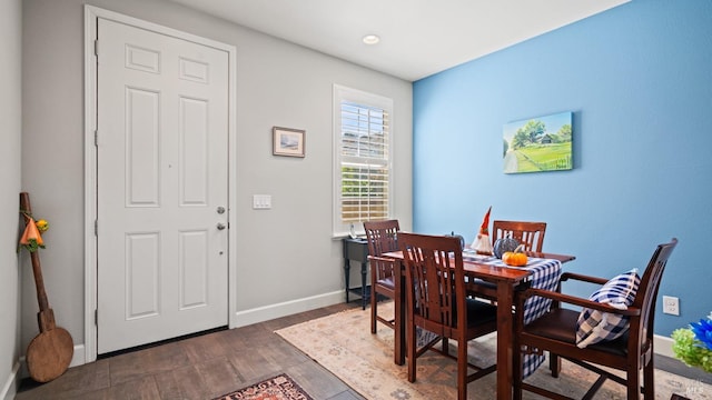 dining area with dark wood-type flooring