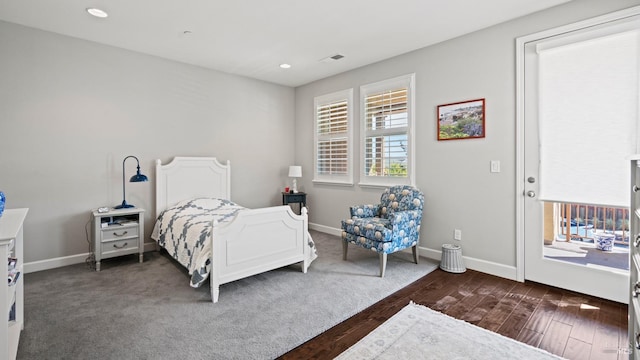 bedroom featuring dark hardwood / wood-style flooring